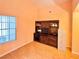 Bright bedroom with hardwood floors, a large window, and a built-in media center with storage at 4484 Warbonnet Way, Las Vegas, NV 89147