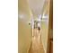 Bright hallway with hardwood floors leads to the dining room and other living spaces at 4484 Warbonnet Way, Las Vegas, NV 89147