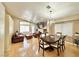 Open-concept living room with hardwood floors, fireplace, and ample seating, great for entertaining at 4484 Warbonnet Way, Las Vegas, NV 89147