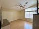 Main bedroom features ceiling fan, window with blinds, wood-look floors, and neutral paint at 4484 Warbonnet Way, Las Vegas, NV 89147