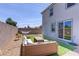 Outdoor living space with modern furniture, gravel, and artificial turf at 5692 Tinar St, Las Vegas, NV 89113