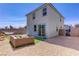Rear view of the house with a nicely arranged backyard and an outdoor seating area at 5692 Tinar St, Las Vegas, NV 89113