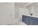 Bathroom featuring a double vanity with a large mirror and a shower-tub combo at 5692 Tinar St, Las Vegas, NV 89113
