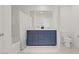 Bathroom with a modern double vanity, a large mirror, and a shower-tub combination at 5692 Tinar St, Las Vegas, NV 89113