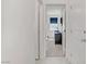 Hallway view to bedroom with neutral color palette at 5692 Tinar St, Las Vegas, NV 89113