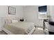 Bright bedroom with a queen-sized bed, simple decor, and natural light at 5692 Tinar St, Las Vegas, NV 89113