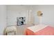 Bright bedroom with simple furnishings, perfect for a , with a play kitchen and table at 5692 Tinar St, Las Vegas, NV 89113