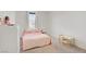 Bedroom with bright natural light, plush carpet, and minimalist decor at 5692 Tinar St, Las Vegas, NV 89113