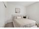 Neutral bedroom with a queen-sized bed, simple decor, and natural light at 5692 Tinar St, Las Vegas, NV 89113