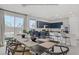 Open dining area featuring a kitchen island and a view to the outdoor space at 5692 Tinar St, Las Vegas, NV 89113