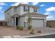Stylish two-story home with desert landscaping, gray exterior paint and a tiled roof at 5692 Tinar St, Las Vegas, NV 89113