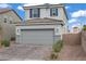 Charming home featuring a gray exterior, tiled roof, and an attached two-car garage at 5692 Tinar St, Las Vegas, NV 89113