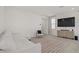 Comfortable living room with sofa, accent chair, and a large television screen at 5692 Tinar St, Las Vegas, NV 89113
