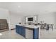 Open-concept living room and dining area with stylish island seating at 5692 Tinar St, Las Vegas, NV 89113
