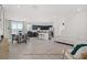 Open living area with modern furniture, island seating, and lots of natural light at 5692 Tinar St, Las Vegas, NV 89113