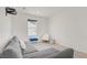 Comfortable loft area with a large sofa, chair, and an accent ottoman at 5692 Tinar St, Las Vegas, NV 89113