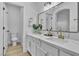 Bathroom features double sinks, elegant gold fixtures and marble-style counter at 10200 Wood Work Ln, Las Vegas, NV 89135