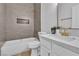 Bathroom with modern fixtures, bathtub and tiled shower with niche at 10200 Wood Work Ln, Las Vegas, NV 89135