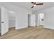 Spacious bedroom with a closet and a view to a modern bathroom at 10200 Wood Work Ln, Las Vegas, NV 89135