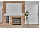 Living room featuring a stone fireplace, mantel, and wine cooler at 10200 Wood Work Ln, Las Vegas, NV 89135