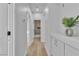 Bright hallway view featuring modern cabinets and access to bathroom and rooms at 10200 Wood Work Ln, Las Vegas, NV 89135