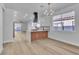 Bright open kitchen with an island, marble countertops, and stainless steel appliances at 10200 Wood Work Ln, Las Vegas, NV 89135