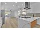 Contemporary kitchen featuring a center island, stainless steel appliances, and an open layout at 10200 Wood Work Ln, Las Vegas, NV 89135