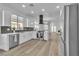 Bright modern kitchen features stainless steel appliances, a center island, and an open layout at 10200 Wood Work Ln, Las Vegas, NV 89135