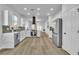 Spacious kitchen with stainless steel appliances, white cabinetry, and ample counter space at 10200 Wood Work Ln, Las Vegas, NV 89135