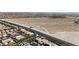 Aerial neighborhood view showcasing residences and desert landscape at 10412 Deer Heights St, Las Vegas, NV 89178