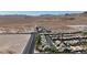 Desert landscape with aerial views of the home exteriors, streets, and community at 10412 Deer Heights St, Las Vegas, NV 89178