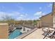 Balcony overlooking the pool with wrought iron railings and outdoor seating at 10412 Deer Heights St, Las Vegas, NV 89178