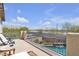 Balcony overlooking the surrounding neighborhood with wrought iron railings and outdoor seating at 10412 Deer Heights St, Las Vegas, NV 89178