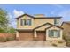 Charming two-story home featuring a three-car garage, neat landscaping, and decorative shutters at 10412 Deer Heights St, Las Vegas, NV 89178