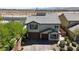 Charming two-story home with a well-maintained yard, brick driveway, and inviting curb appeal at 10412 Deer Heights St, Las Vegas, NV 89178