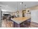 Bright kitchen boasts a spacious island, pendant lighting, and stainless steel appliances at 10412 Deer Heights St, Las Vegas, NV 89178