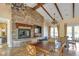 Clubhouse interior featuring a stone fireplace, tile floors and several seating arrangements at 10412 Deer Heights St, Las Vegas, NV 89178