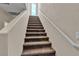 Carpeted stairway leading to upper floors, offering seamless transition between levels at 10412 Deer Heights St, Las Vegas, NV 89178