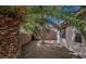 Backyard featuring rock landscaping, block wall and mature palms at 10505 Jeremy Ridge Ave, Las Vegas, NV 89144