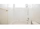 Full white bathroom with tub and shower combo at 10505 Jeremy Ridge Ave, Las Vegas, NV 89144