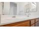 Bathroom with double sink vanity and wood cabinets at 10505 Jeremy Ridge Ave, Las Vegas, NV 89144