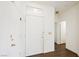Bright entryway showcasing hardwood floors, a white front door, and views into other rooms at 10505 Jeremy Ridge Ave, Las Vegas, NV 89144