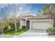 Inviting single-story home featuring a landscaped front yard, neutral paint, and a two-car garage at 10505 Jeremy Ridge Ave, Las Vegas, NV 89144