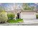 Charming single-story home with a tile roof, well-maintained lawn, and an attached two-car garage at 10505 Jeremy Ridge Ave, Las Vegas, NV 89144