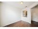 Bright living room featuring wood floors, neutral walls, and an open view to the kitchen at 10505 Jeremy Ridge Ave, Las Vegas, NV 89144