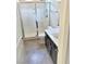 Bathroom featuring a large shower with glass door, toilet, sink with cabinets, and tile flooring at 1128 Via Della Curia, Henderson, NV 89011