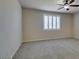 Carpeted bedroom with a ceiling fan and natural light from plantation shuttered windows at 1128 Via Della Curia, Henderson, NV 89011