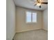 Bedroom with neutral carpet, window with plantation shutters, and a ceiling fan with lighting at 1128 Via Della Curia, Henderson, NV 89011