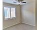 Neutral bedroom with carpeted floor and large shuttered window at 1128 Via Della Curia, Henderson, NV 89011