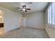 Carpeted bedroom with plantation shutters and an en suite bathroom at 1128 Via Della Curia, Henderson, NV 89011